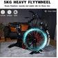 Black stationary exercise bike with red and teal illuminated 5KG flywheel in home setting, featuring smooth ride technology a