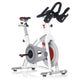 White and gray stationary exercise bike with red accents, black handlebars, and gray pedals on white background