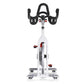 White and black stationary indoor cycling bike with red accents, curved handlebars, and digital display, viewed from front on