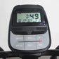 Black and gray elliptical machine console displaying digital time and fitness metrics with labeled control buttons including 