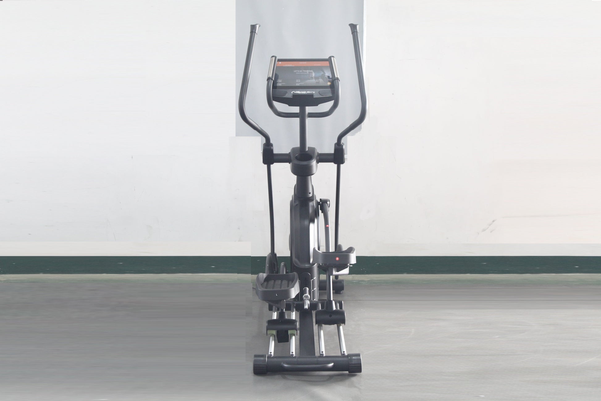 Black elliptical machine with digital display console, dual handles, and wide pedal base on white background, front view