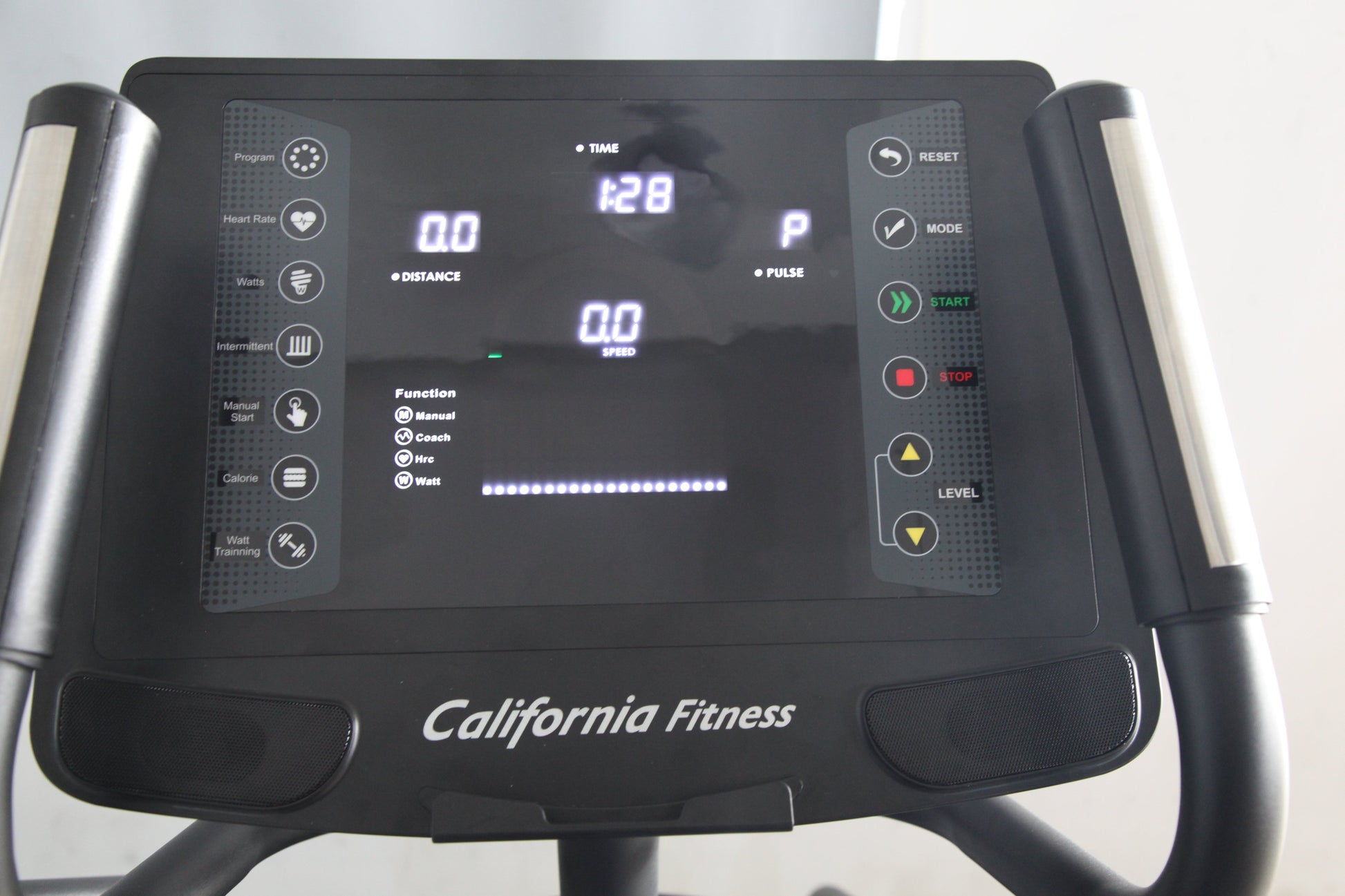 Black California Fitness elliptical machine console with digital display showing time, distance, speed, and pulse metrics, fe