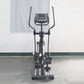 Black elliptical incline trainer with dual handles, digital display console, and foot pedals on white background