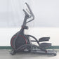 Black elliptical machine with red accent trim, dual handlebars, and padded seat on white background