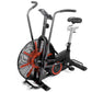 Black and red air resistance exercise bike with large fan wheel, dual handles, digital display, and black padded seat on whit