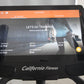California Fitness E8i elliptical machine with black frame and silver handles, displaying iConsole training app screen showin
