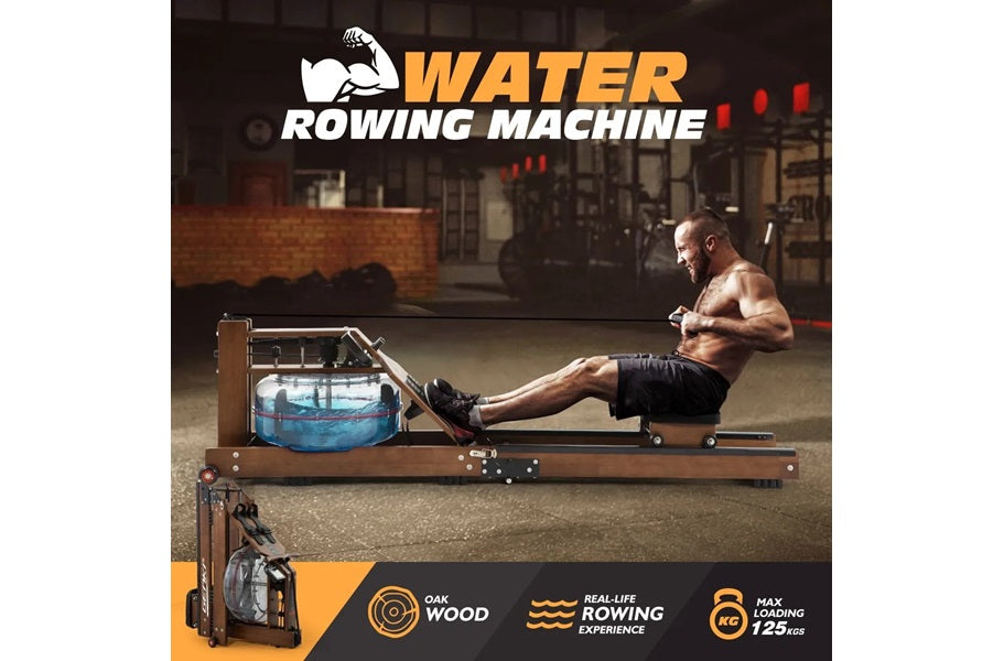 Water rowing machine with wooden frame and blue water tank, shirtless man in black shorts using machine in gym setting