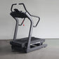 California Fitness IT8 Incline Trainer Treadmill with black running deck, gray frame, and curved handles on white background