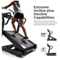 Woman using black motorized treadmill with extreme incline capability, shown at high angle on white background