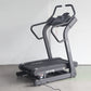 Black California Fitness IT8 incline trainer treadmill with digital display console and curved handles on white background
