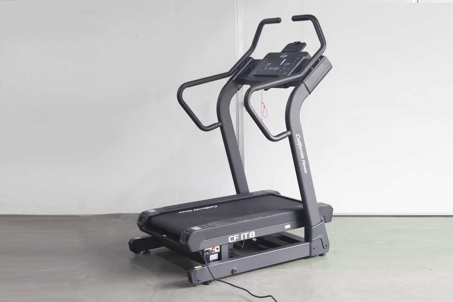 Black California Fitness IT8 incline trainer treadmill with digital display console and curved handles on white background
