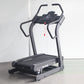 California Fitness IT8 incline trainer treadmill with black and gray frame, digital display console, and red safety clip on w