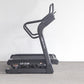 Black California Fitness IT8 incline trainer treadmill with dual handles and control panel, displayed on gray floor against w