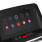 Black folding treadmill with touchscreen display showing colorful workout apps and icons, physical control buttons below scre