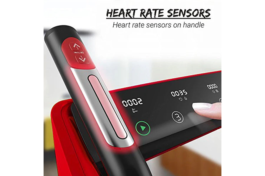Black and red folding treadmill with heart rate sensors on handle, displaying digital screen with readings