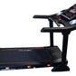 Black folding treadmill with digital console, smartphone holder, and orange accents on white background