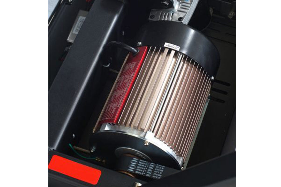 Cylindrical motor with vertical metal cooling fins, red accent panel, and black housing mounted in treadmill frame assembly
