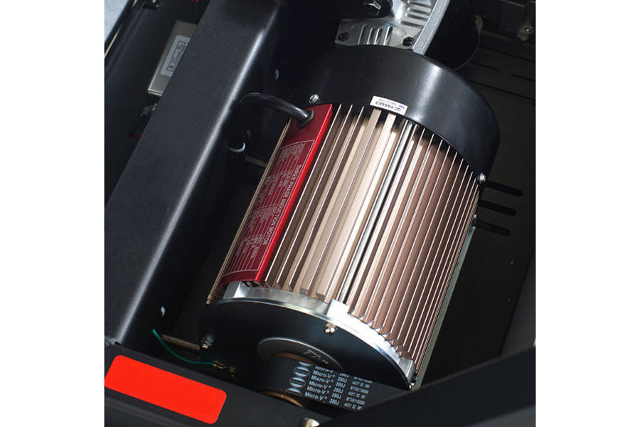 Black electric motor with silver cooling fins, red accent panel, and black base mounted on treadmill frame