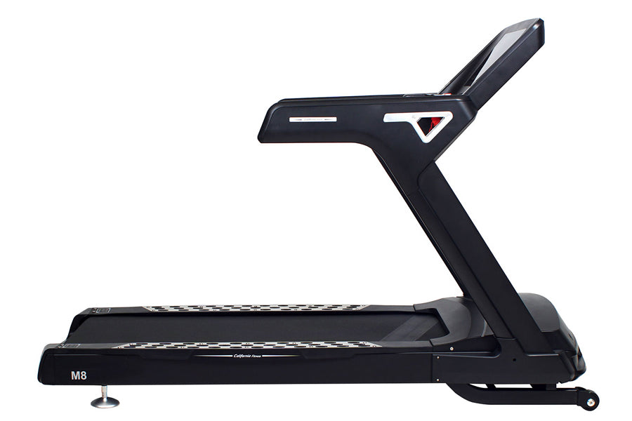 Black M8 treadmill with digital display console and tall upright handrail, shown against white background