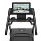 Black treadmill with touchscreen display showing Vision Run interactive program interface, dual grip handles, and control pan