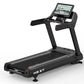 Black M8.5T treadmill with cushioned running deck, padded handrails, and tablet display showing fitness content on white back