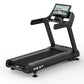 Black motorized treadmill with digital touchscreen console displaying workout interface, padded running deck, and dual handra