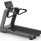 Black and gray commercial treadmill with digital touchscreen console displaying workout metrics and colorful app icons