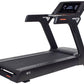 Black M12 treadmill with digital display console, orange accent trim, and cushioned running deck on white background