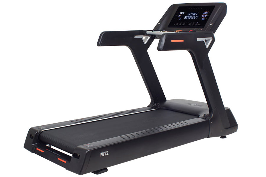Black M12 treadmill with digital display console, orange accent trim, and cushioned running deck on white background