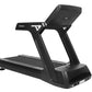 Black motorized treadmill with digital console, wide running belt, and sturdy frame on white background