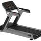 Black and gray motorized treadmill with digital display console, red accent details, and M12 model designation on white backg