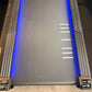 California Fitness Malibu 6.5 treadmill with blue accents, textured running deck, and side rails with caution labels, viewed 