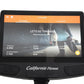 Black recumbent exercise bike with curved console displaying iConsole training app showing workout metrics and runner on scre