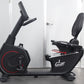 California Fitness RB8 black recumbent exercise bike with red accent wheel, padded seat, and adjustable backrest on white bac