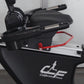 Black recumbent exercise bike with padded seat, handlebars with red safety handles, and silver frame details, displayed again