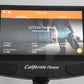 California Fitness E8i elliptical machine with orange and black console displaying training stats and runner image on screen