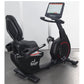 Black recumbent exercise bike with digital display console, padded seat, and red accent details on wheel