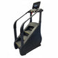 Black and gray commercial stair climber with dual handrails, textured steps, and digital touchscreen display on white backgro