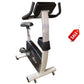 Upright exercise bike with black and silver frame, padded seat and handlebars, digital console display, and wheeled base on w
