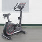 California Fitness U8 upright exercise bike with black frame, red accent wheel, gray seat, and digital display console on whi