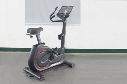 California Fitness U8 upright exercise bike with black frame, red accent wheel, gray seat, and digital display console on whi