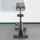 California Fitness U8 upright exercise bike with black frame, padded seat, handlebar console display, and foot pedals on whit