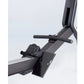 Black hybrid rowing machine with padded seat, horizontal handlebar, and foot pedals on white background