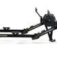 Black Concept2 RowErg indoor rowing machine with dual black resistance fans, extended arm, and stabilizing legs on white back