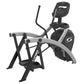 Black and gray Cybex 525AT Arc Trainer elliptical machine with digital console and dual handlebars on white background