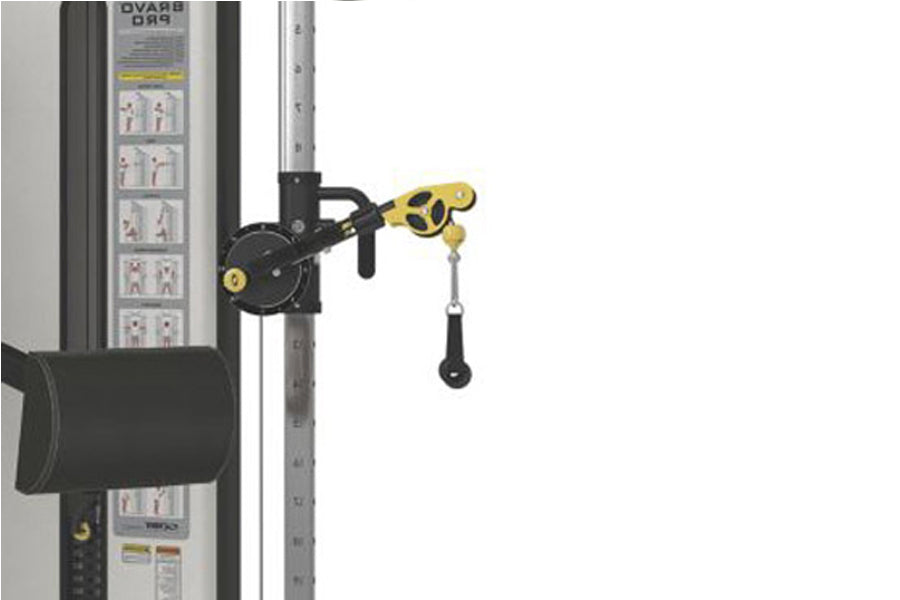 Black and yellow pulley attachment mounted on Cybex functional trainer frame with cable and weight stack visible