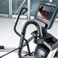 Black and gray Cybex R Series arc trainer with digital touchscreen display showing workout metrics, curved handlebars, and pe