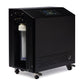 Black compact chiller unit with digital control panel, visible filter cartridge inside glass chamber, ventilation grilles, an