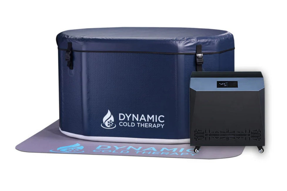 Dynamic Cold Therapy navy blue inflatable oval cold plunge with chiller unit on purple mat, flat lay