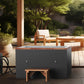 Dark gray and copper cold plunge tub with wooden bench on outdoor patio, paired with black heating unit